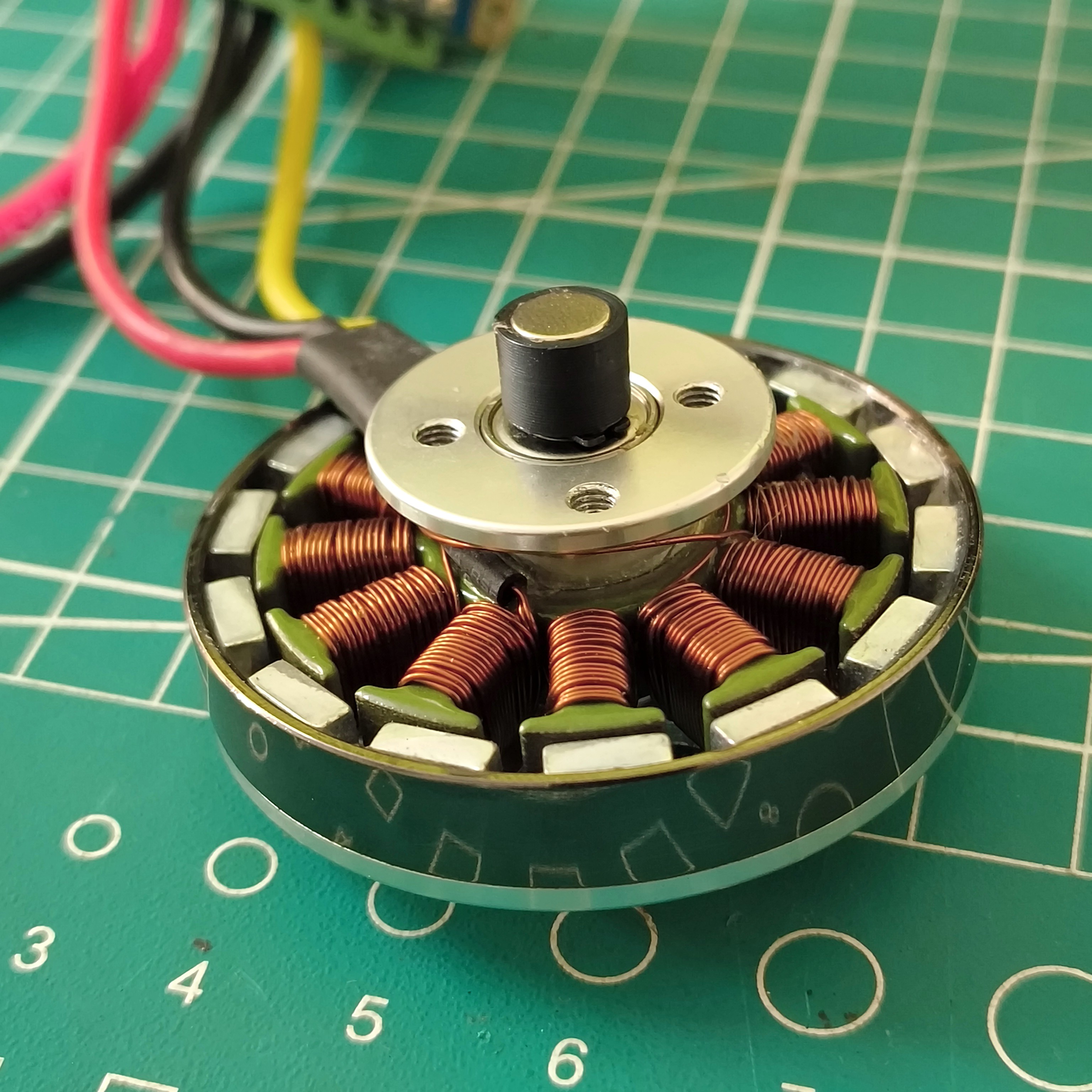 Magnet holder placed over the rear shaft.